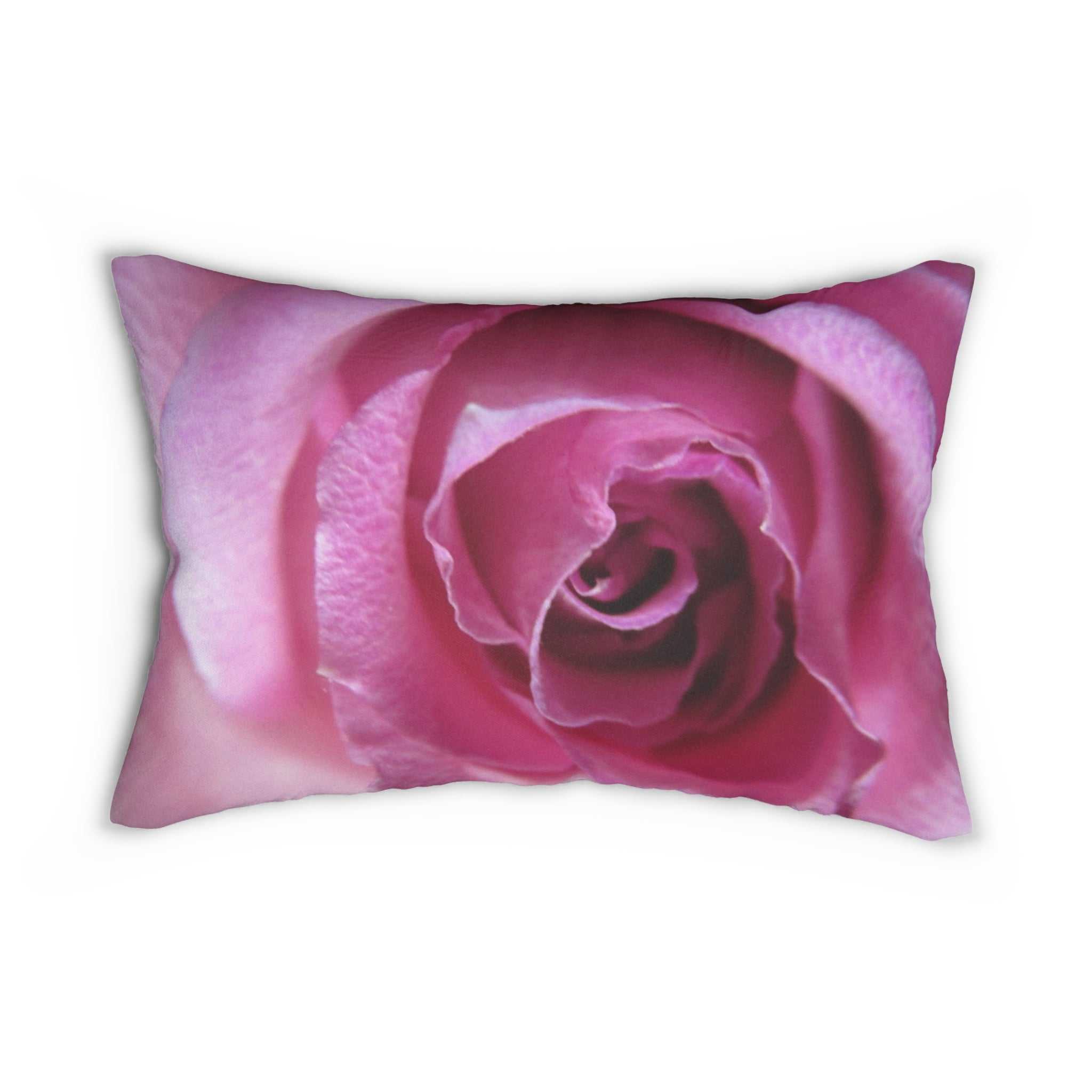 Pillow with a pink rose design on a white background