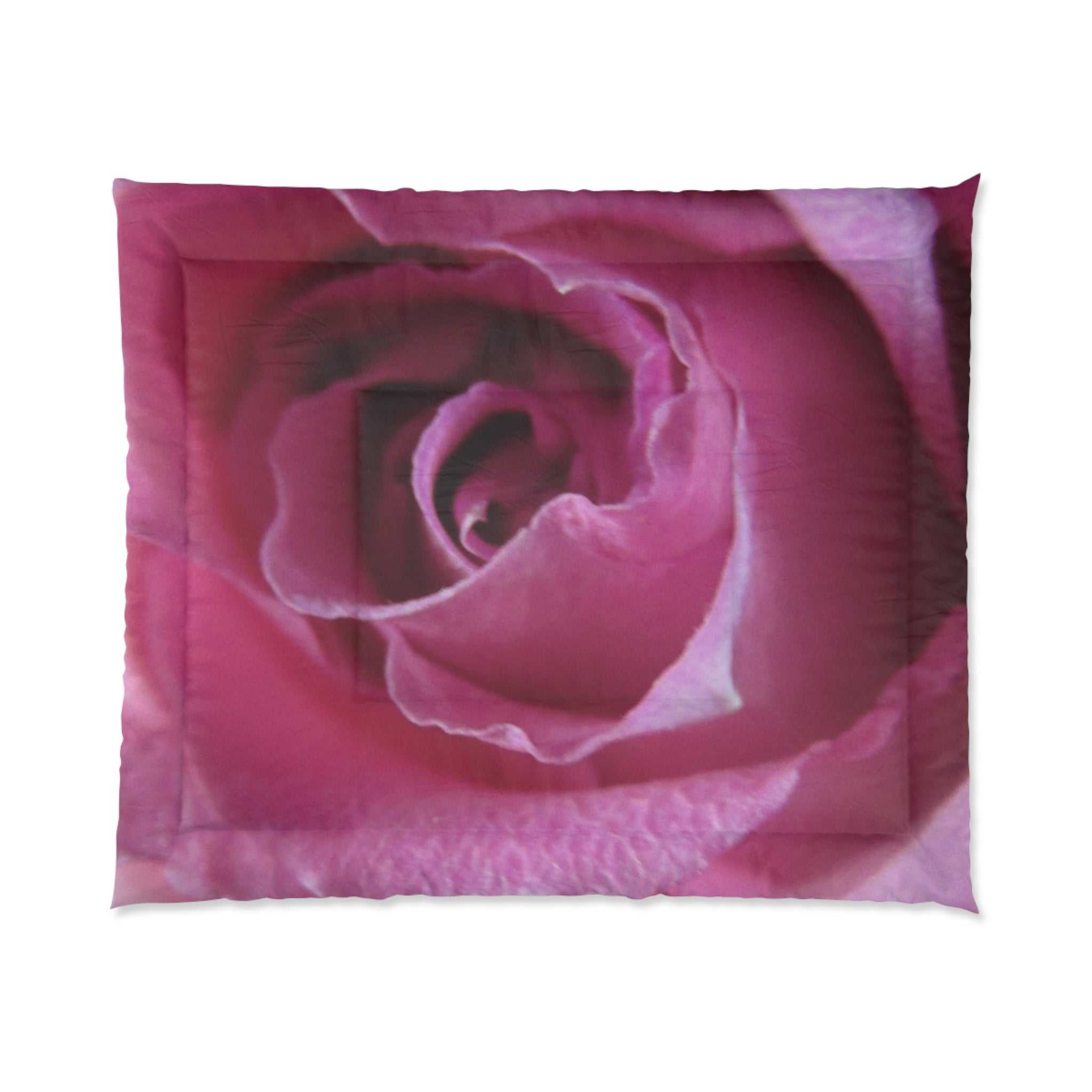 Pink rose-patterned comforter on a white background