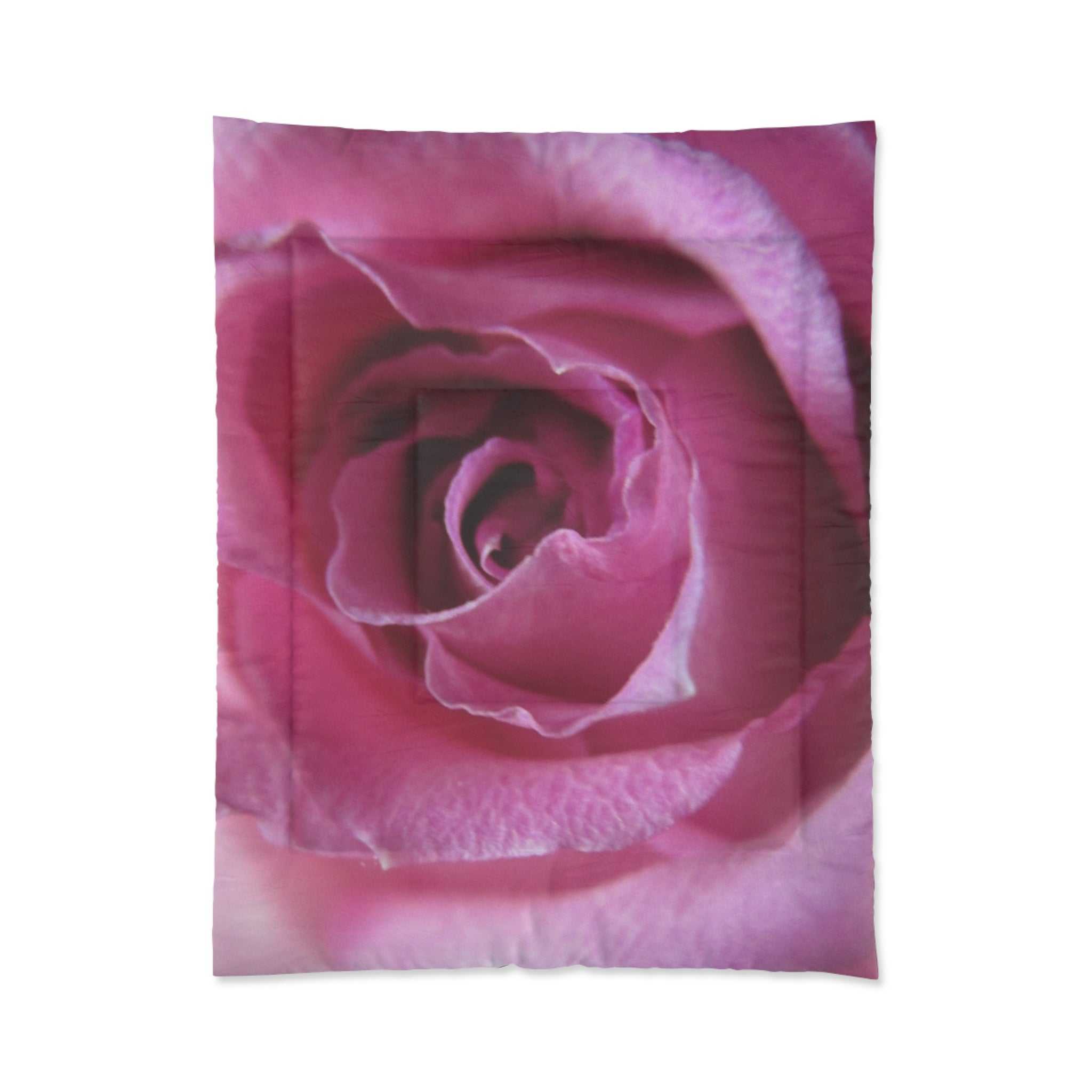 Close-up of a pink rose comforter on a white background