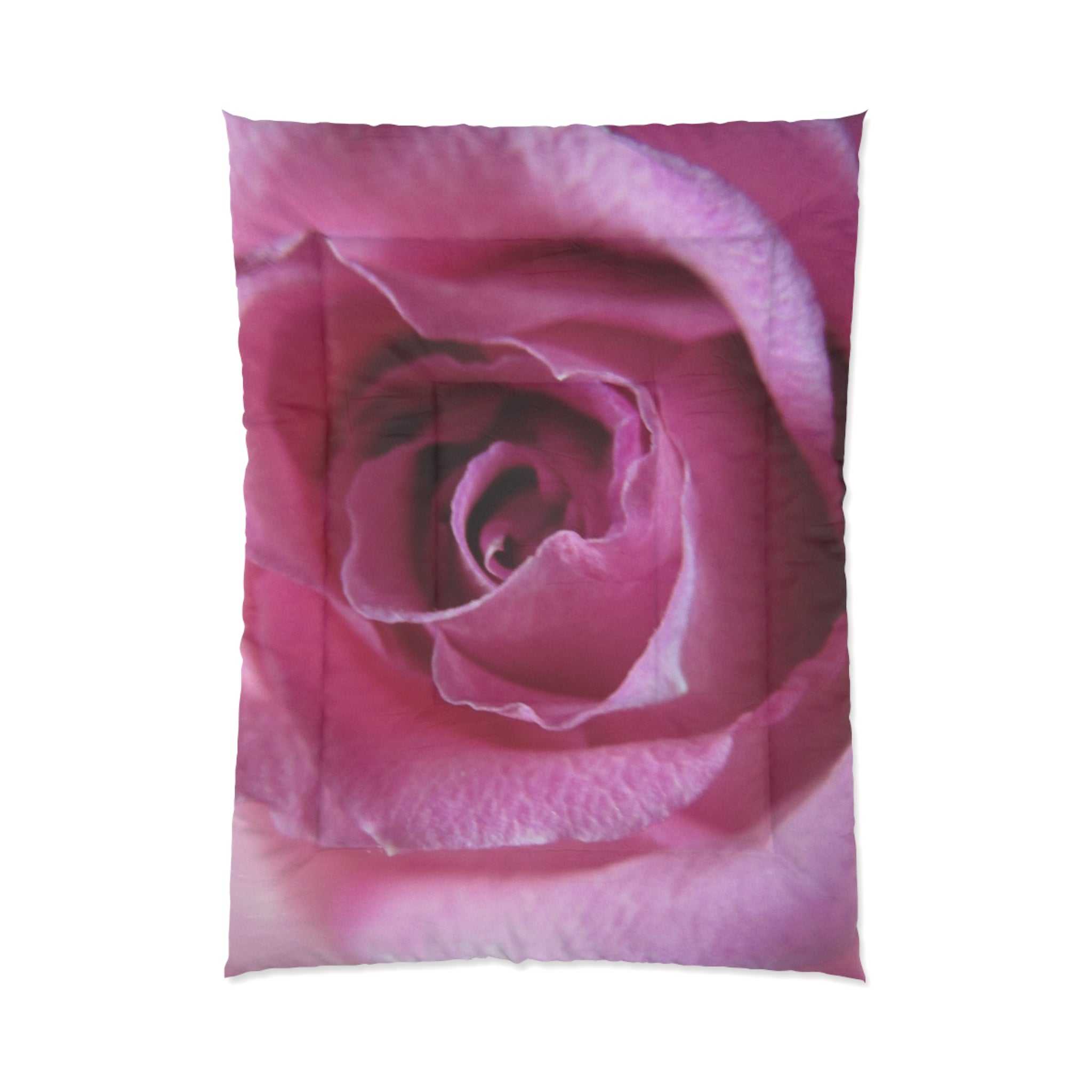 Pink rose-patterned comforter on a white background