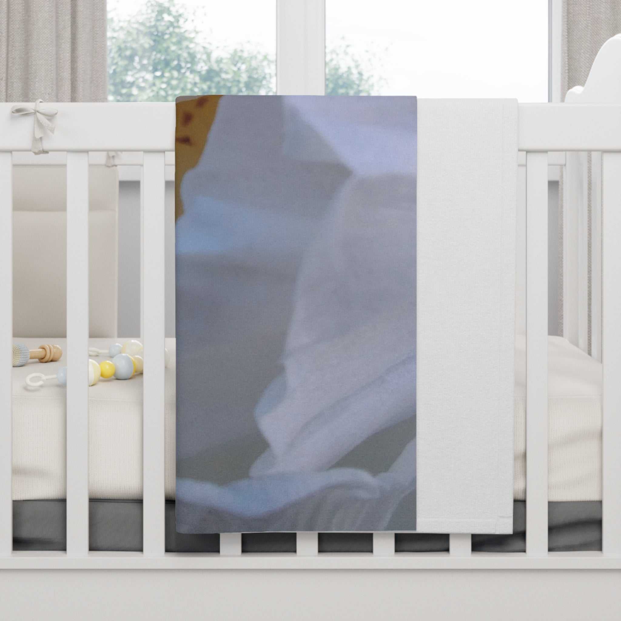 Cozy Floral soft fleece baby blanket with pure white flower design draped over a white crib railing