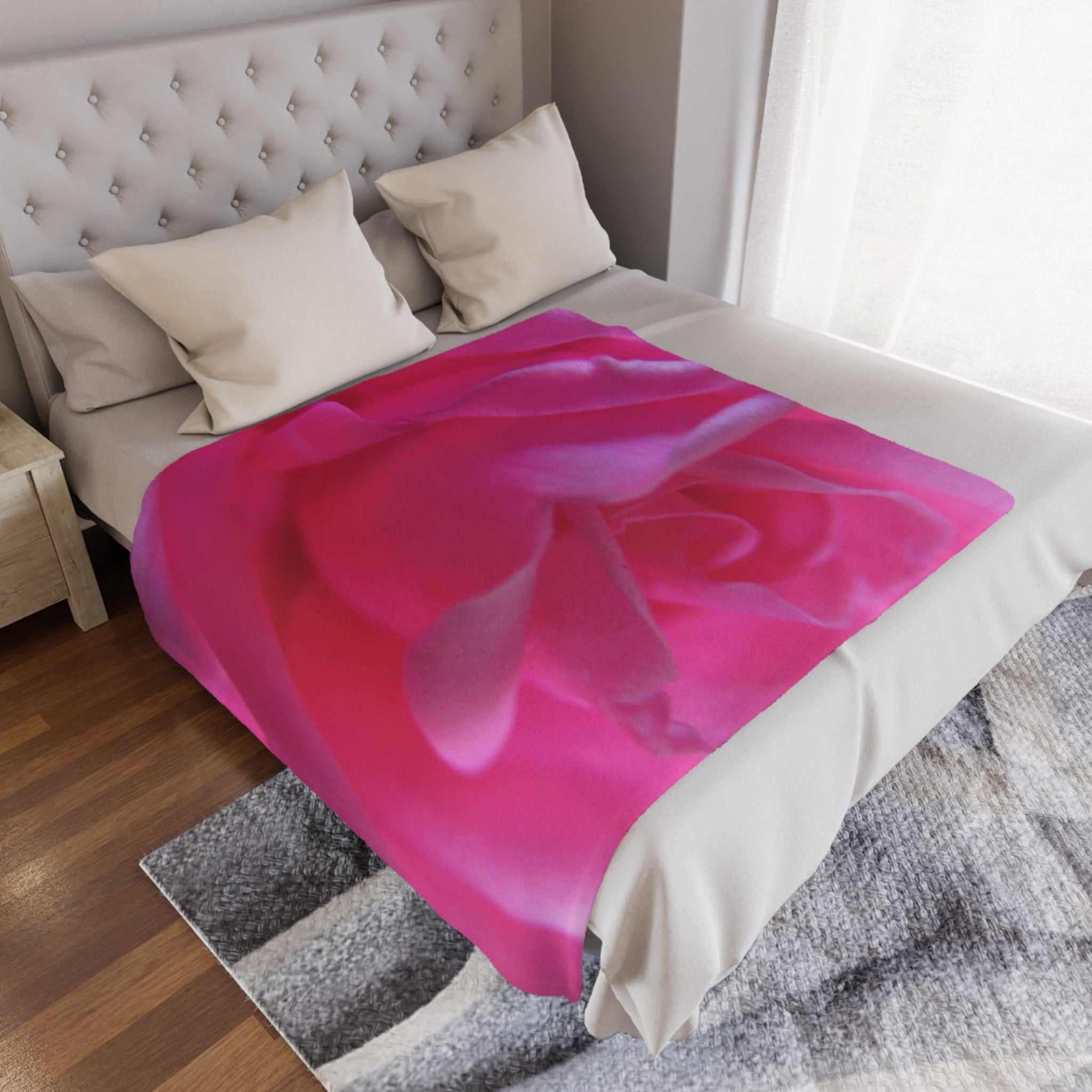 Soft pink rose pattern minky blanket on bed for cozy luxury and comfort